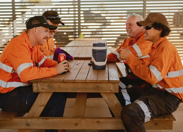Finmec employees sitting at the lunch tables