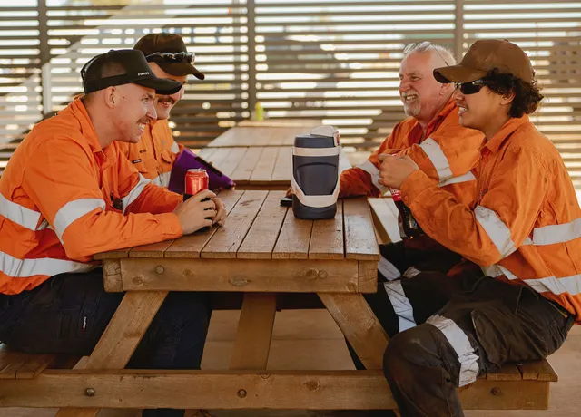 Finmec employees sitting at the lunch tables