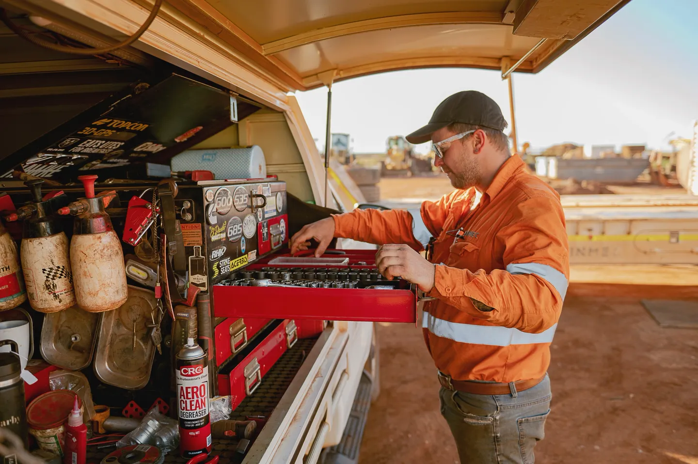 Finmec employee searching through toolbox