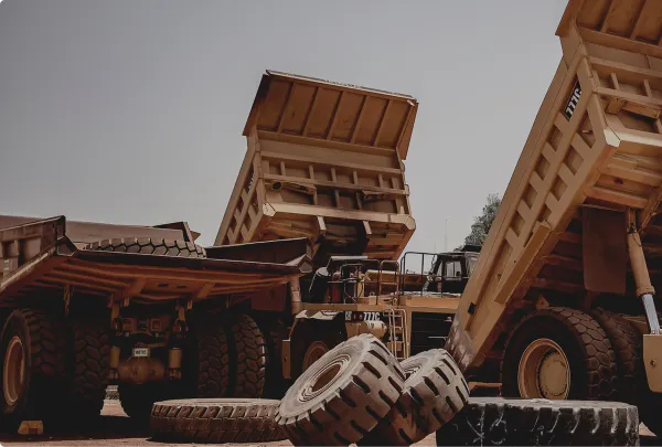 3 large Cat dump trucks 